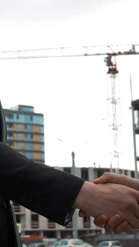 Vertical of Customer and architecture shaking hands Stock Footage 305493516