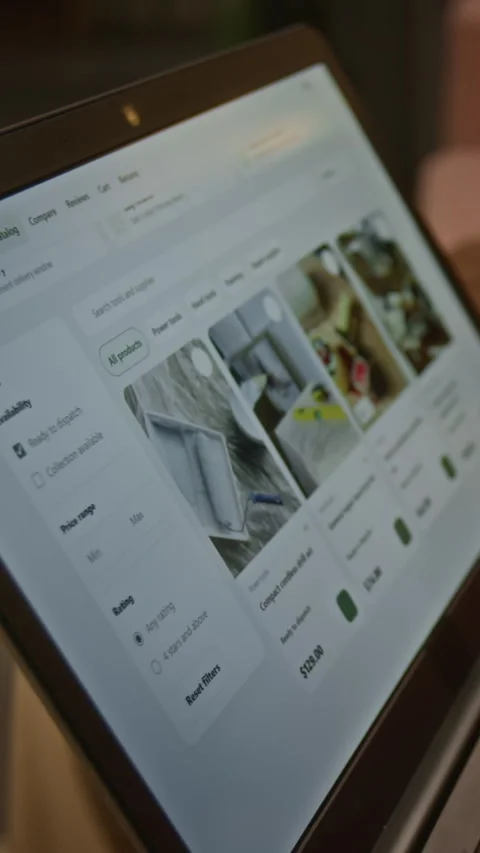 Vertical of Customer Browsing Online Hardware Catalog on Laptop Screen Stock Footage 344868685