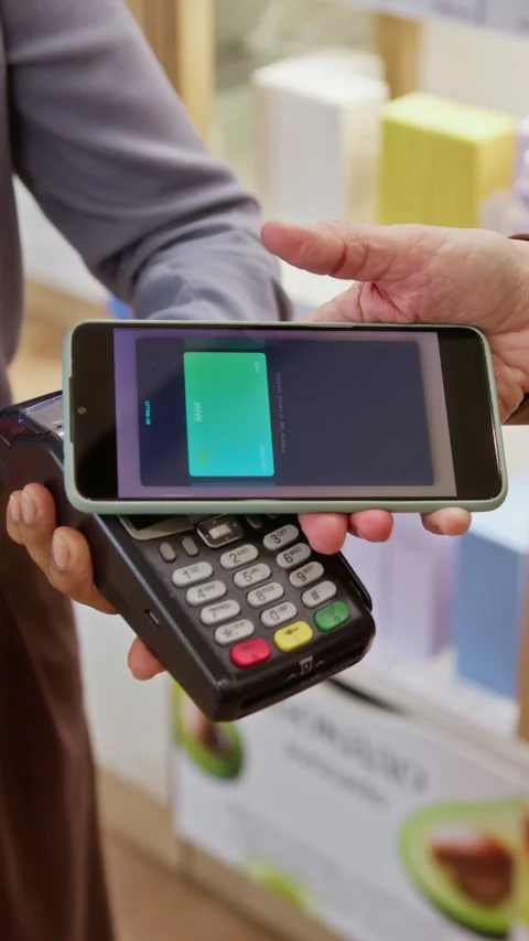 Vertical of Customer Making Contactless Payment with Smartphone on Pos Terminal Stock Footage 345507669