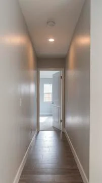 Vertical Dark hallway going to the master bedroom Stock Photos