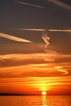 Vertical dark orange sunset composition. Photos