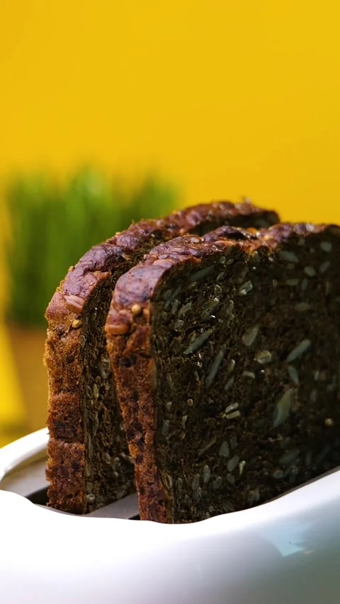 Vertical Dark Whole Grain Bread Jumping Out Of Toaster Slow Motion Stock Footage 292560600
