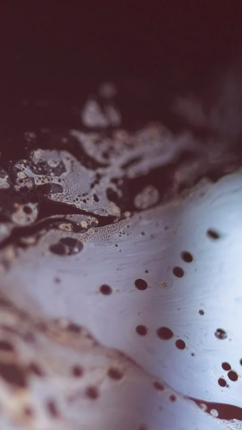 Vertical defocused acid fluid ink foam bubbles Video stock 303878299
