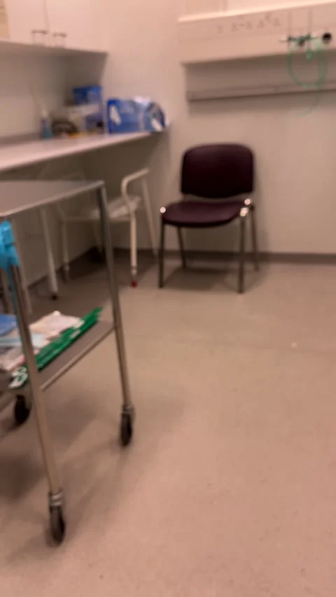 Vertical. Defocused right pan of medical procedure room. Stock Footage 306453069