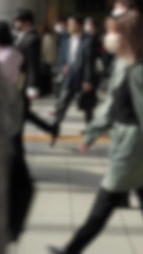 Vertical defocused shot of city commuters walking on pavement Stock Footage 320476855