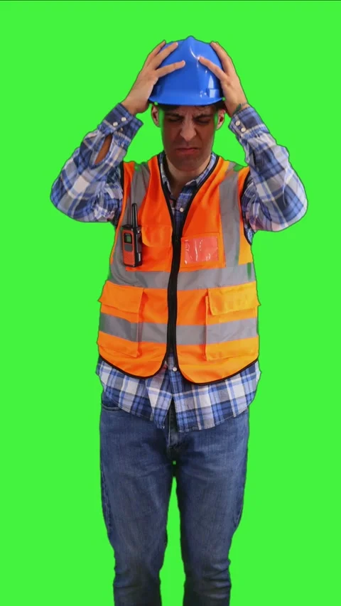 Vertical Desperate construction worker holding head in frustration, wearing.. Video stock 287328070