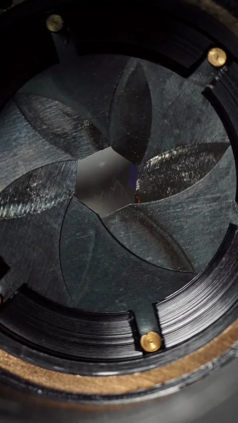 Vertical detailed macro view of vintage camera lens aperture blades with Stock Footage 345206118