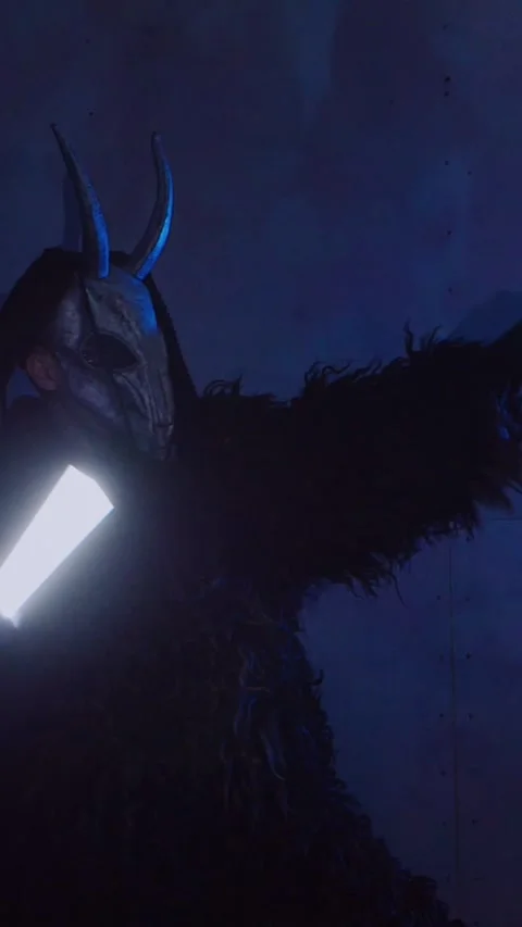 Vertical, The devil monster dances with RGB sticks in his hands. Stock Footage 301543686