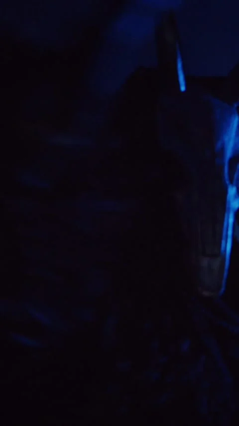 Vertical, The devil monster dances with RGB sticks in his hands. Stock Footage 301543732