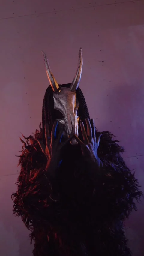 Vertical, The devil monster dances with RGB sticks in his hands. Stock Footage 301543764