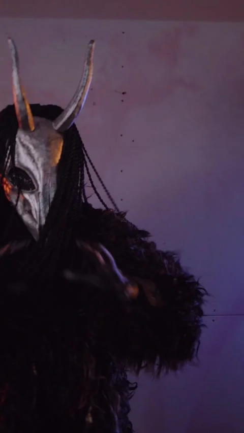 Vertical, The devil monster dances with RGB sticks in his hands. Stock Footage 301543773