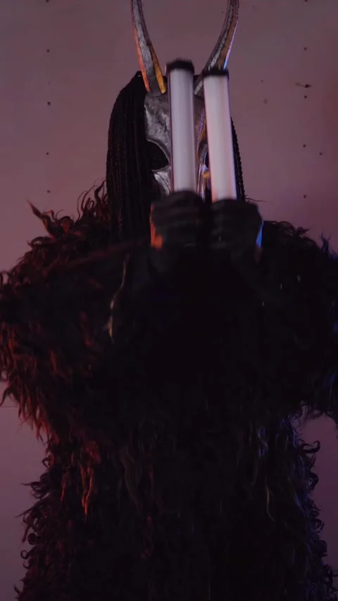 Vertical, The devil monster dances with RGB sticks in his hands. Stock Footage 301543832