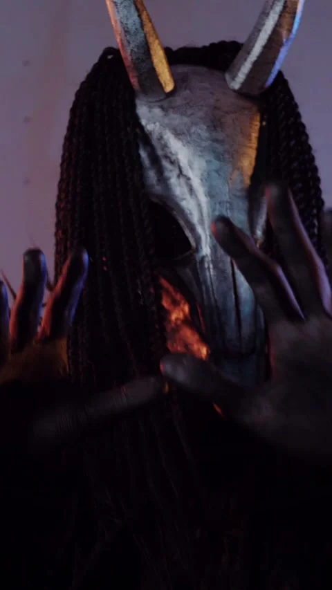 Vertical. The devil monster dances with RGB sticks in his hands. A mystical man Stock Footage 302732088