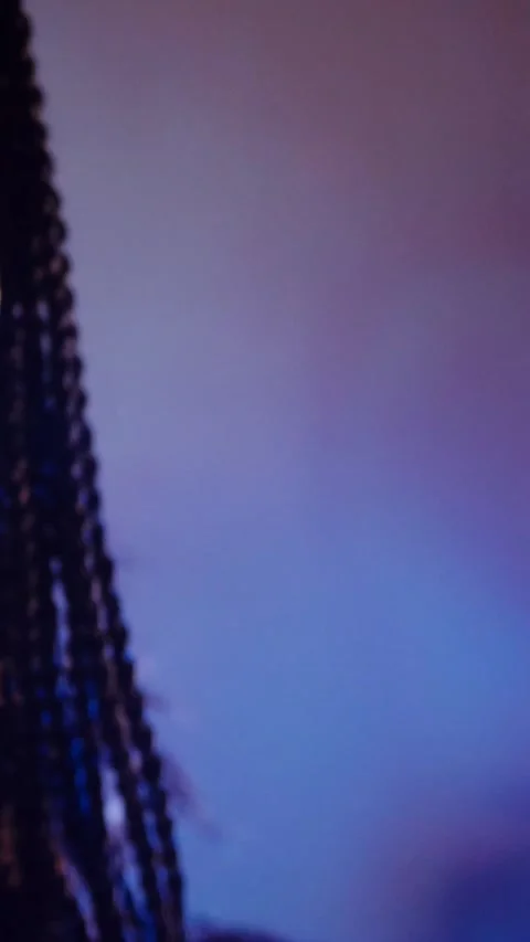 Vertical. The devil monster dances with RGB sticks in his hands. A mystical man Stock Footage 302732157