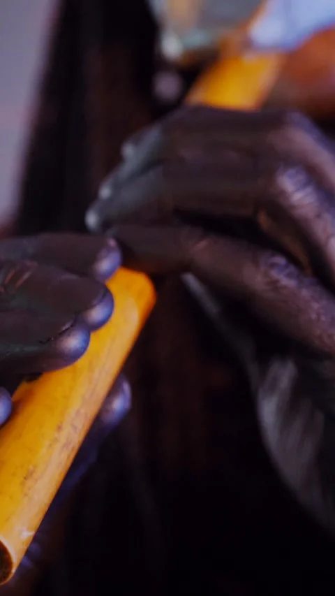 Vertical. The devil monster dances with RGB sticks in his hands. A mystical man Stock Footage 302732185