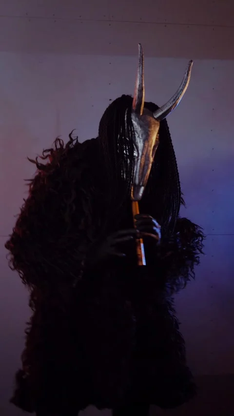 Vertical. The devil monster dances with RGB sticks in his hands. A mystical man Stock Footage 302732203