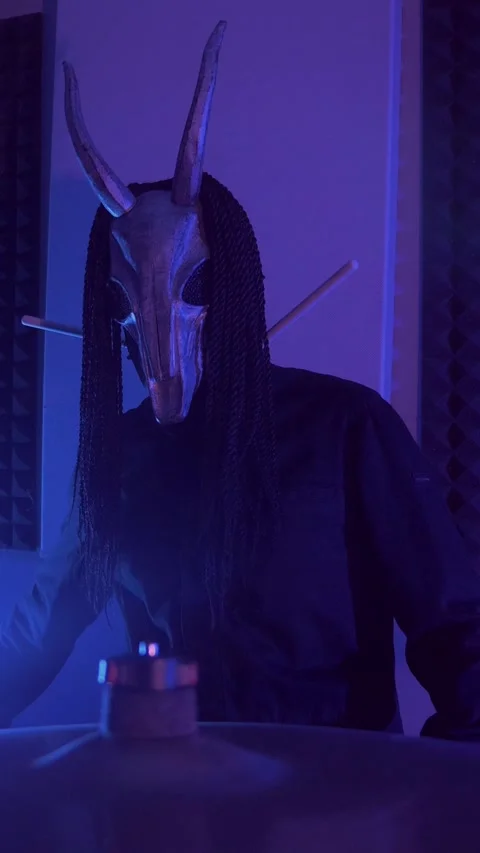 Vertical. The devil monster plays the drums. A mystical man Stock Footage 302192335