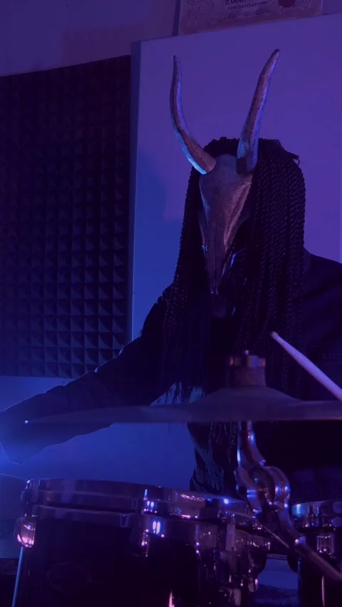 Vertical. The devil monster plays the drums. A mystical man Stock Footage 302192390