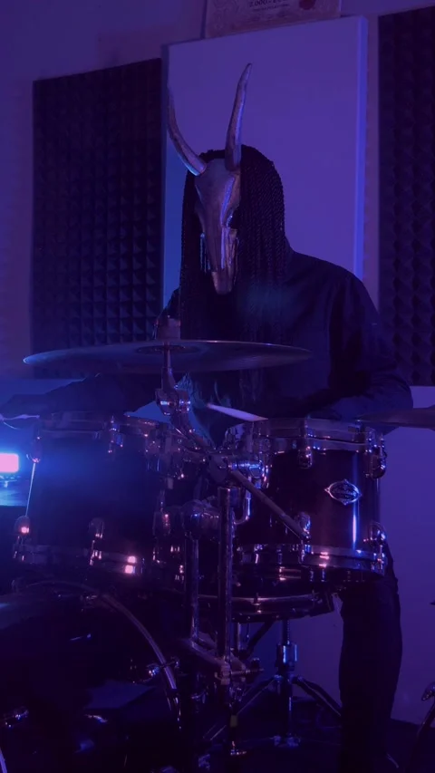 Vertical. The devil monster plays the drums. A mystical man Stock Footage 302192435