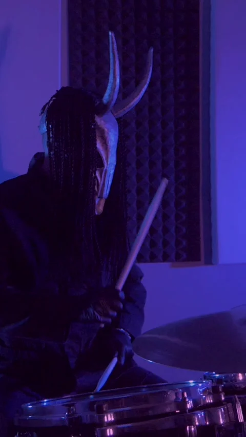 Vertical. The devil monster plays the drums. A mystical man Stock Footage 302192563