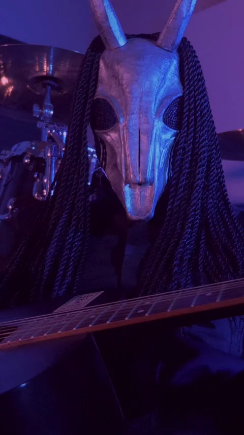 Vertical. The devil monster plays the guitar. A mystical man in a scary mask Stock Footage 302193074