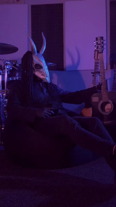 Vertical. The devil monster plays the guitar. A mystical man in a scary mask Stock Footage 302193079