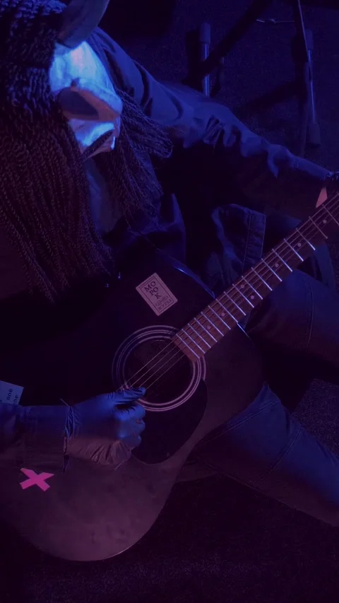 Vertical. The devil monster plays the guitar. A mystical man in a scary mask Stock Footage 302193262