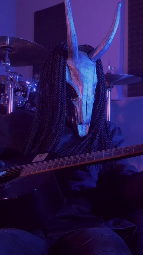 Vertical. The devil monster plays the guitar. A mystical man in a scary mask Stock Footage 302193281