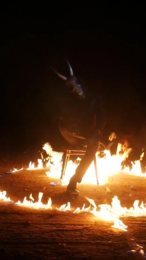 Vertical, The devil sits on a chair and burns. Monster burning. A man burns on a Stock Footage 300264684