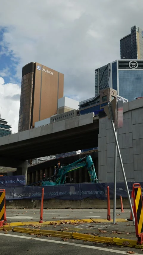 Vertical digger passes Sydney skyscrapers 6K Stock Footage 309164231