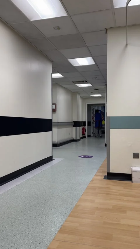 Vertical. Distant shot of Radiology staff in hospital corridor. Stock Footage 340755165