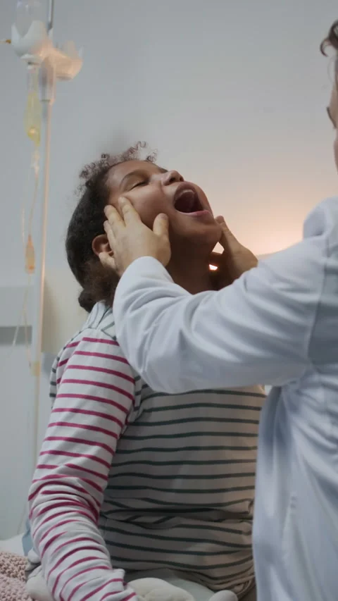 Vertical of Doctor Doing Lymph Nodes Checkup of Little Female Patient Stock Footage 302366654