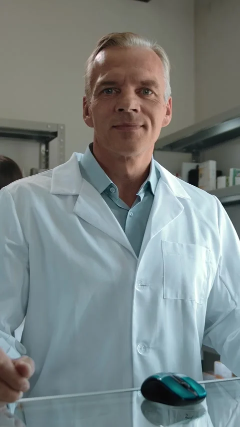 Vertical of Doctor pharmacist at the computer in the interior of his own Stock Footage 276792867