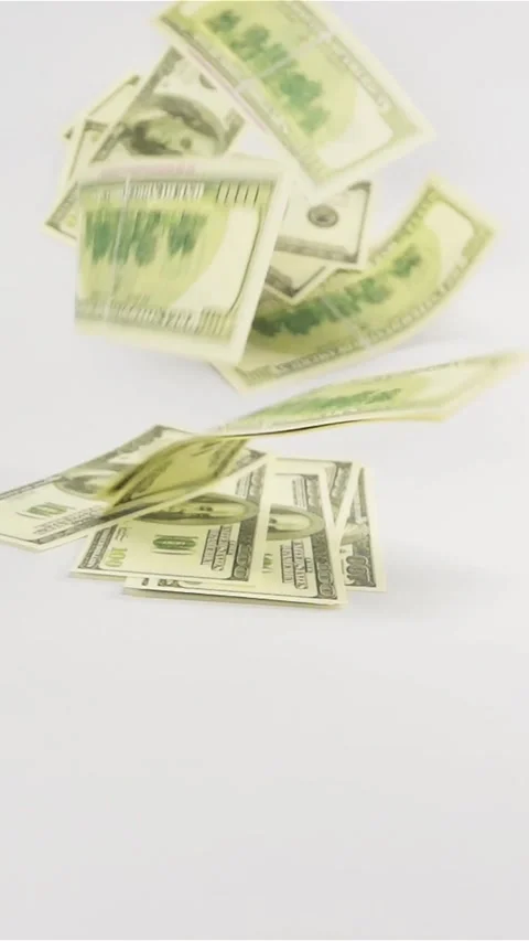 Vertical of Dollars banknotes rain falling on white table cyclorama Stock Footage 305474507