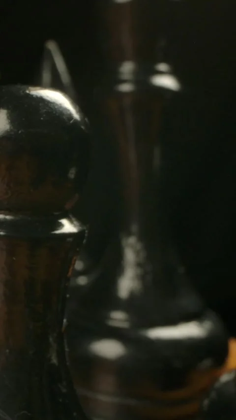 Vertical of Dolly camera movement behind black chess pieces in start position. Stock Footage 276920321