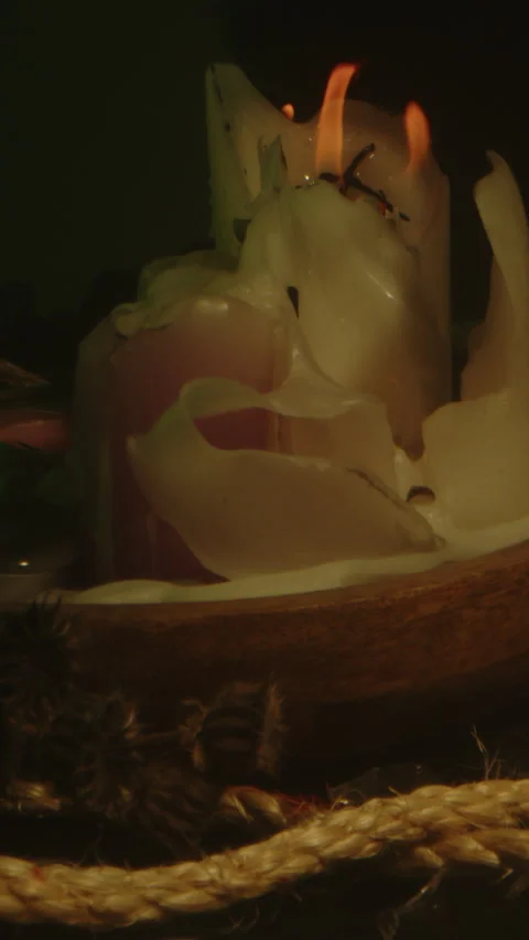 Vertical Dolly in of a macabre occult altar with burning candles in a smoke Video stock 336368926