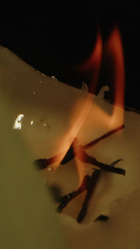 Vertical dolly out of orange flames and revealing a macabre occult altar used Video stock 336321488