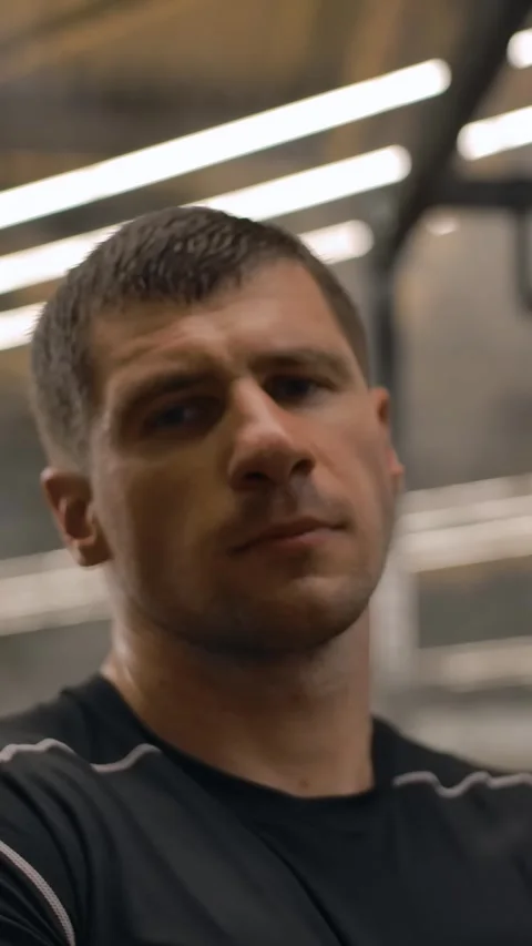 Vertical of Dolly shot on the face of professional athlete in the gym Stock Footage 276928224