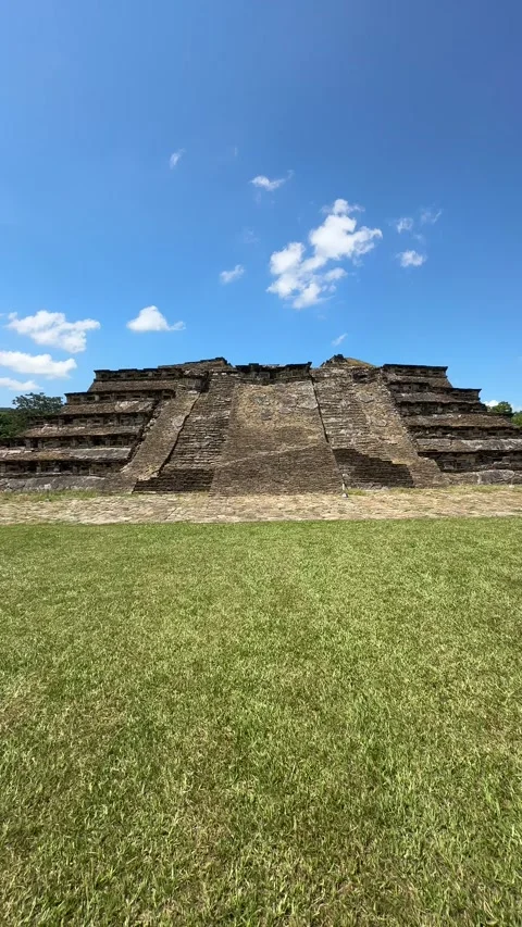 Vertical dolly-in view of pyramid with grass and sky, Tajín Mexico, Aug 2 2025 Stock Footage 315004524