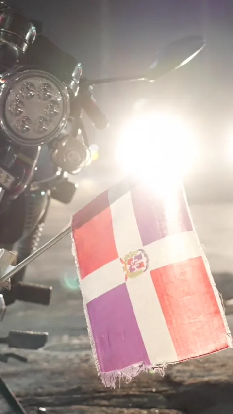 Vertical dominican republic flag on the front fender of a parked motorcycle. The Video stock 292216470