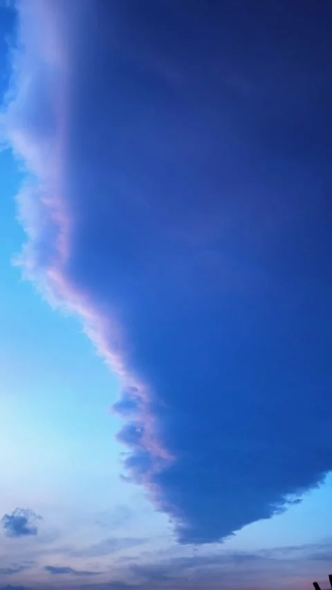 Vertical Dramatic Cumulus Cloud Front with Pink and Blue Tones at Twilight Stock Footage 332881399
