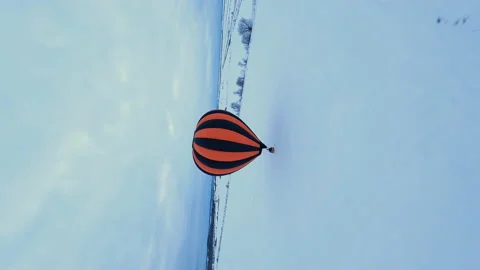 Vertical, Dramatic Dynamic FOV Aerial View of Hot Air Balloon Parachute in Stock Footage 195454492