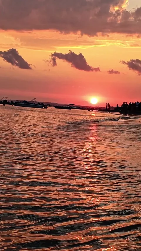 Vertical Dramatic Pink and Orange Ocean Sunset with Silhouettes Stock Footage 334012823