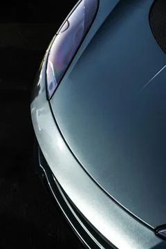 Vertical dramatic shot of the headlight of a luxury car Stock Photos
