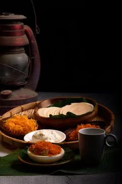 Vertical dramatic Thai crispy pancakes topped with strips of egg yolks. Stock Photos