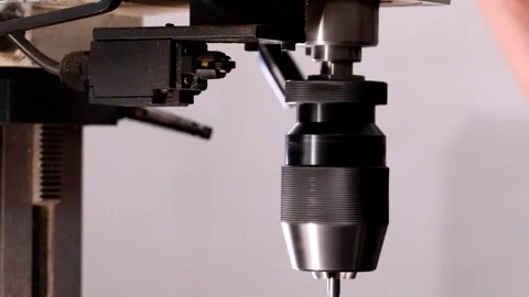 Vertical drilling machine with rotating chuck where the drill bit is inserted Stock Footage 305172717