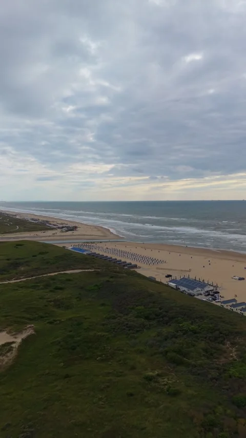 Vertical drone aerial view of Katwijk aan Zee beach Stock Footage 339367092