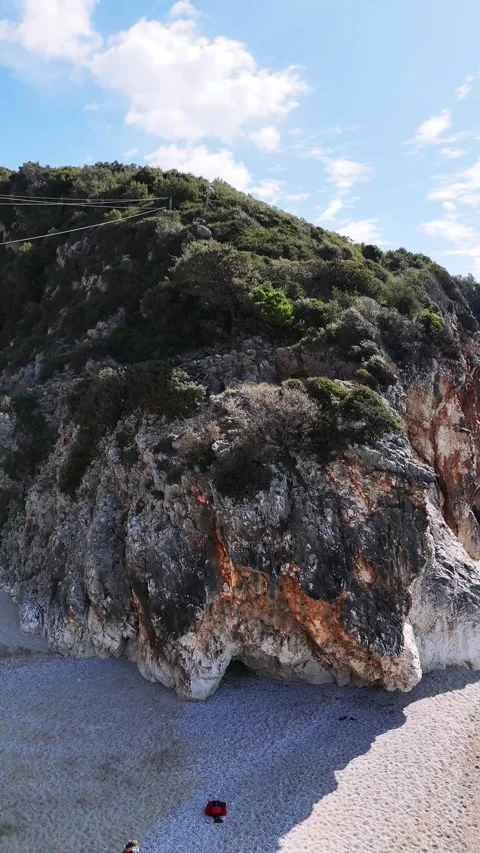Vertical Drone Approach to Turquoise Sea and Shore Stock Footage 331145932