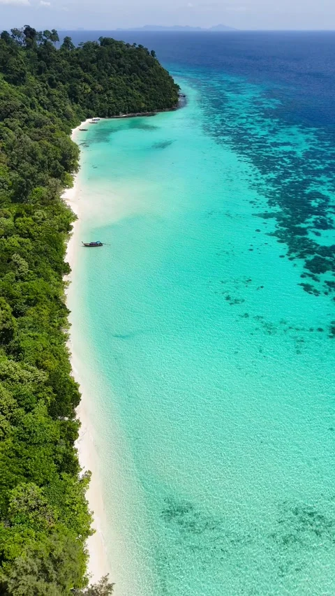 Vertical drone ascending over turquoise water and white beach, Koh Rok – 4K Stock Footage 325022390