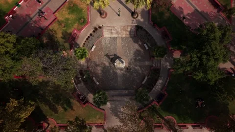 Vertical drone ascent starting from a top-down close-up of a stone well in .. Stock Footage 339210340
